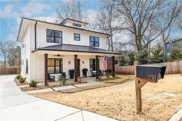 modern inspired farmhouse with ceiling fan and covered porch