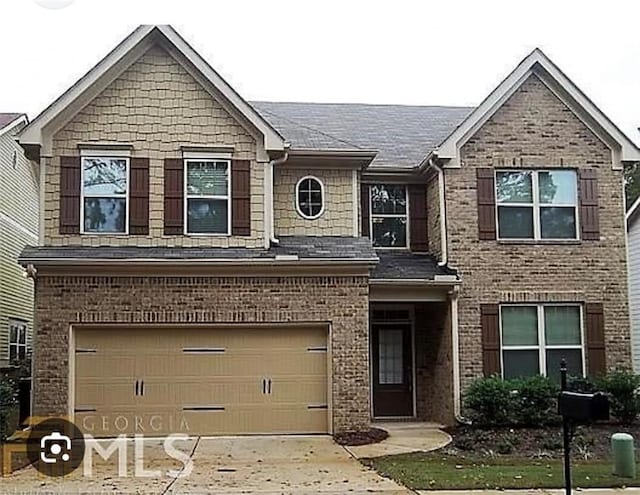 view of front facade with a garage, concrete driveway, and brick siding