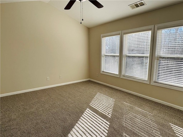 carpeted spare room with ceiling fan and lofted ceiling