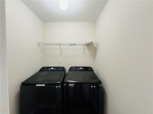 laundry room featuring washing machine and dryer