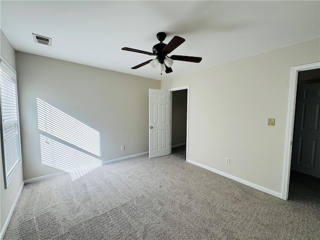 unfurnished room featuring carpet flooring and ceiling fan