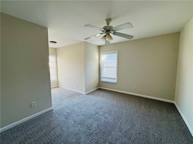 spare room featuring carpet and ceiling fan