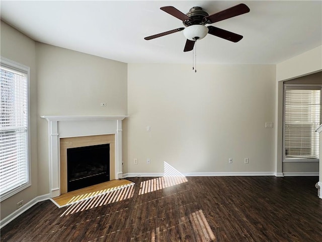 unfurnished living room featuring ceiling fan and wood-type flooring