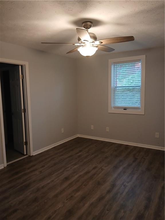 2218 Etowah River Rd, Dawsonville, GA 30534 - spare room featuring ceiling fan, dark wood-style flooring, and a textured ceiling