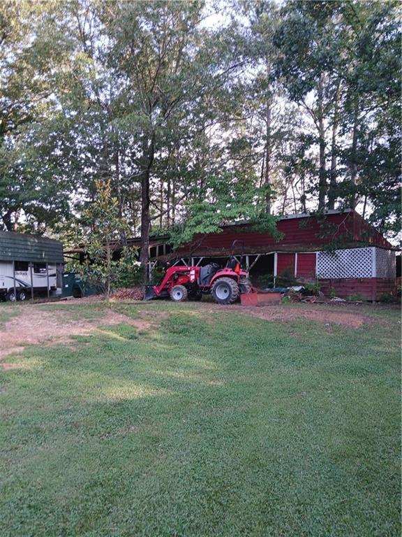 2218 Etowah River Rd, Dawsonville, GA 30534 - view of grassy yard featuring an outbuilding