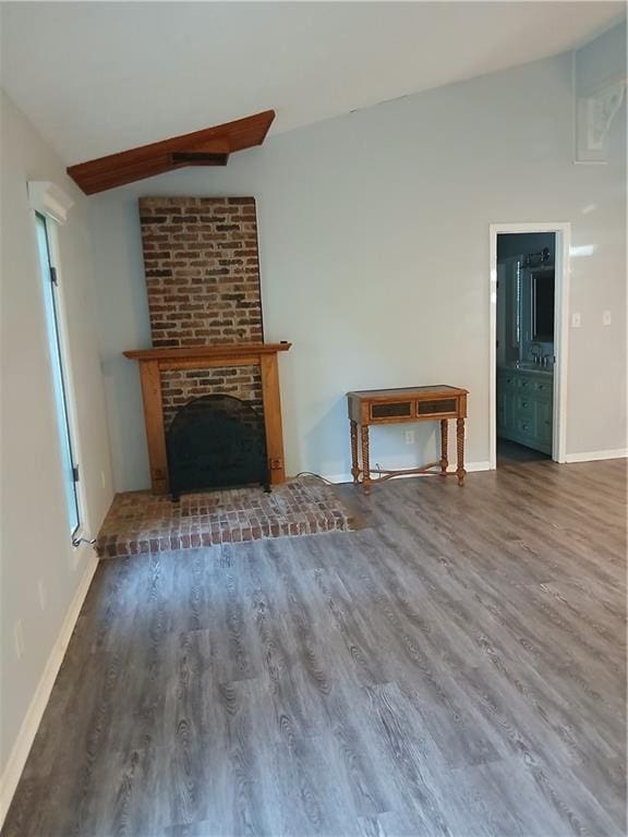 2218 Etowah River Rd, Dawsonville, GA 30534 - unfurnished living room with lofted ceiling, wood finished floors, and a fireplace