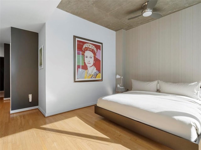 bedroom featuring ceiling fan and hardwood / wood-style floors