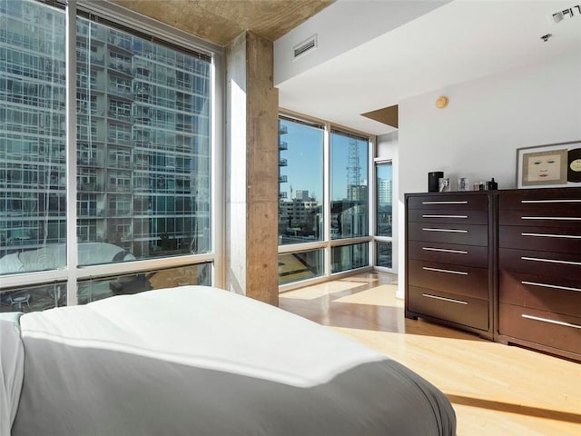 bedroom with floor to ceiling windows