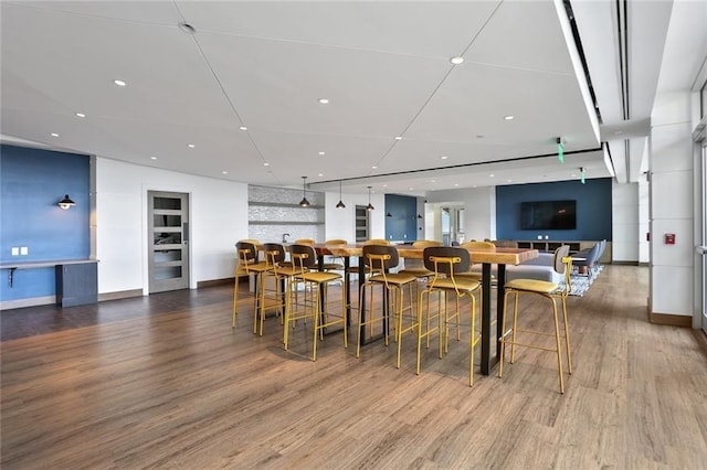 dining room with wood-type flooring