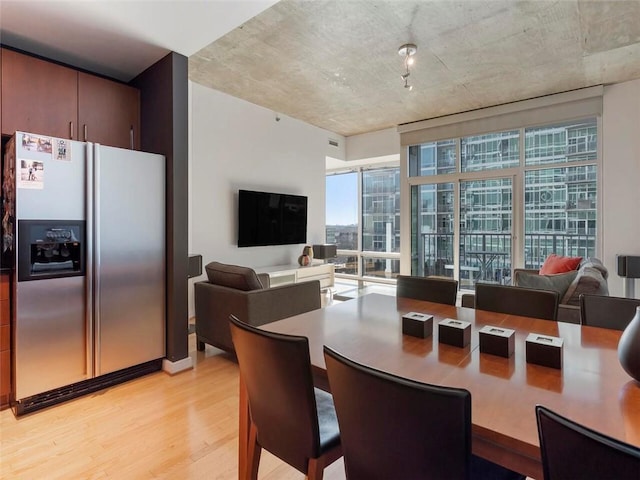 dining space featuring light wood-type flooring