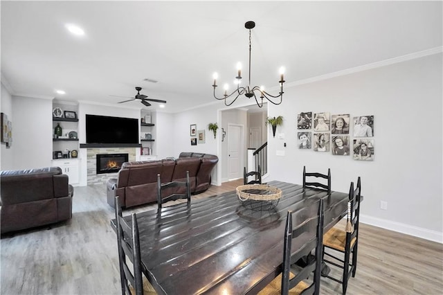 dining area with crown molding and wood-type flooring