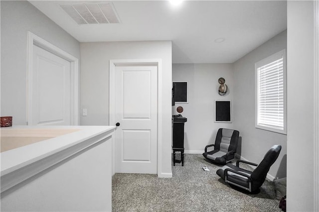 sitting room with light carpet