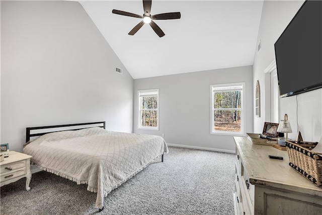 bedroom featuring multiple windows, ceiling fan, carpet floors, and high vaulted ceiling