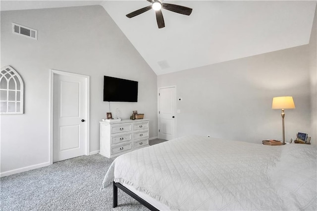 carpeted bedroom with ceiling fan and high vaulted ceiling