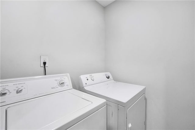 laundry room featuring washing machine and clothes dryer