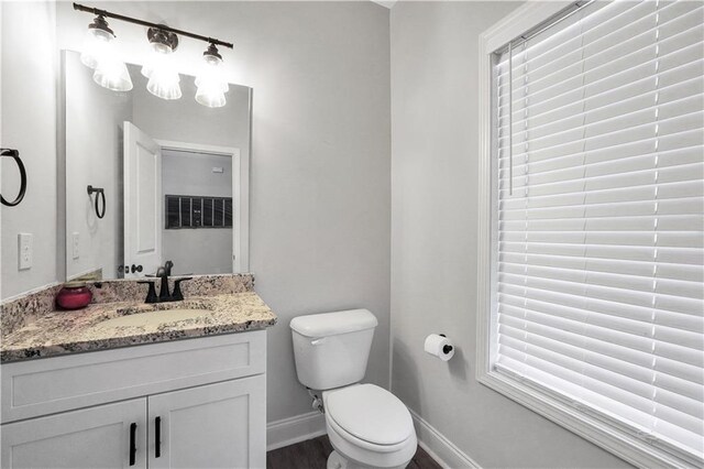 bathroom featuring vanity and toilet