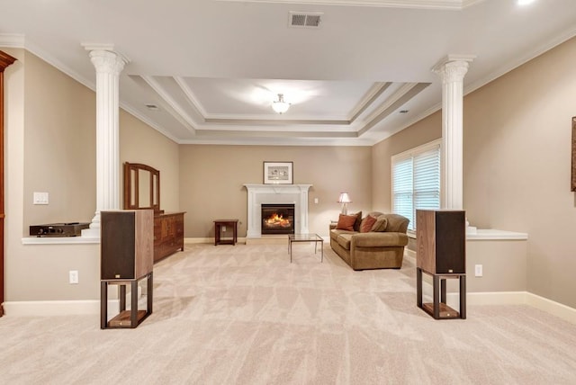 living area with ornate columns, ornamental molding, and light colored carpet