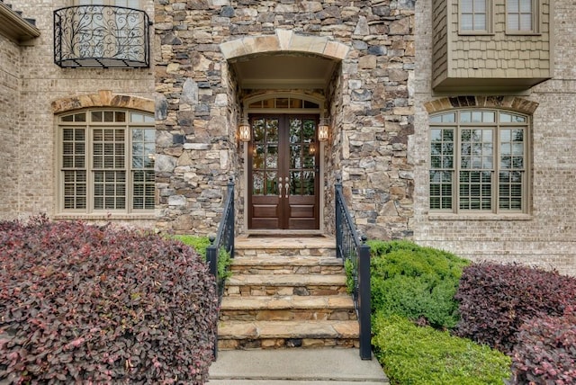 entrance to property with french doors and brick siding