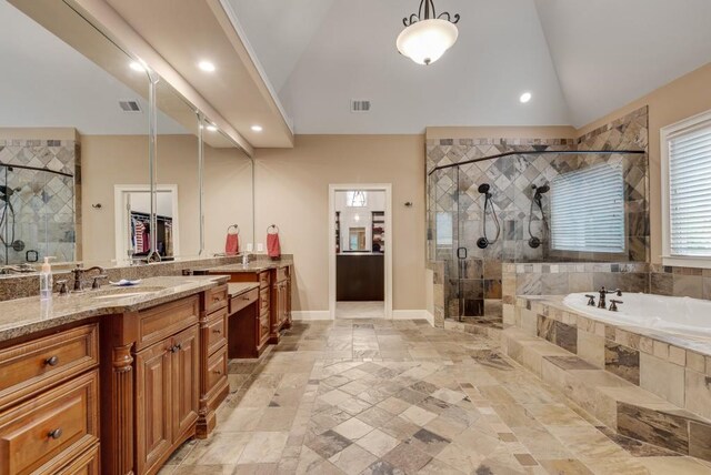 carpeted bedroom with a raised ceiling, ornamental molding, baseboards, and a ceiling fan