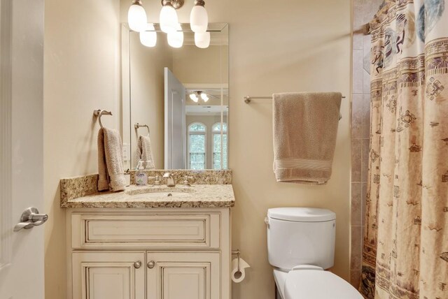 bedroom with a tray ceiling, crown molding, light colored carpet, an office area, and baseboards