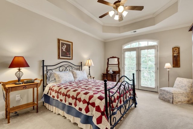 bedroom with carpet, a raised ceiling, access to outside, ornamental molding, and ceiling fan