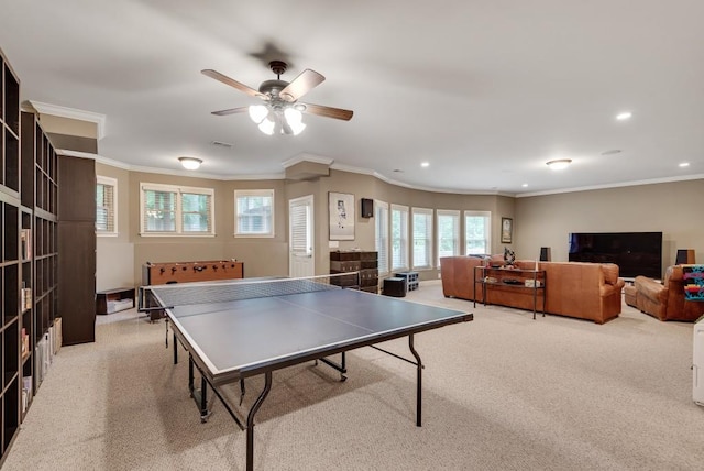 recreation room with carpet flooring, ornamental molding, ceiling fan, and recessed lighting