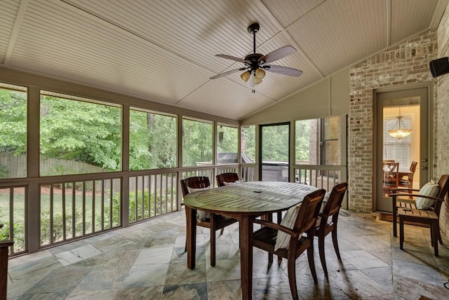 sunroom / solarium featuring lofted ceiling, a ceiling fan, healthy amount of natural light, and outdoor dining area