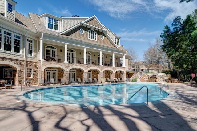 pool with a patio and french doors