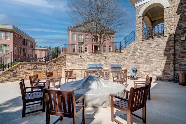 view of patio / terrace with stairs and grilling area