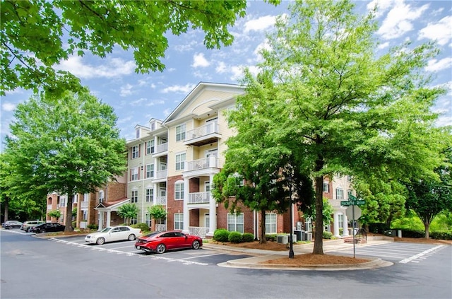 1965 Nocturne Dr Unit 1306A, Alpharetta, GA 30009 - view of apartment building / complex with uncovered parking