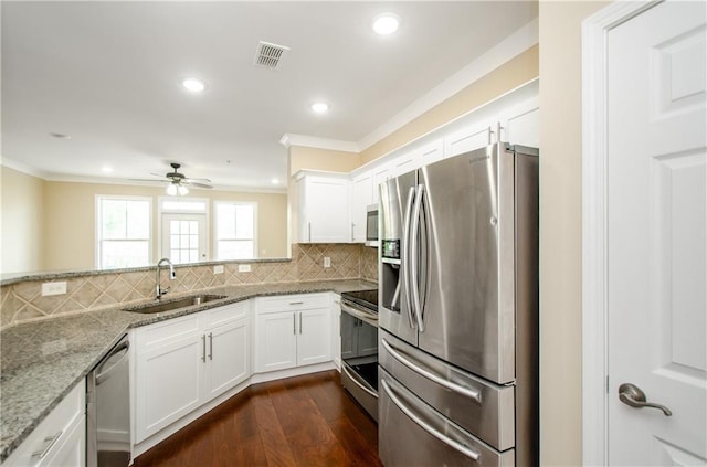 1965 Nocturne Dr Unit 1306A, Alpharetta, GA 30009 - kitchen with appliances with stainless steel finishes, a sink, crown molding, a ceiling fan, and dark wood-style floors