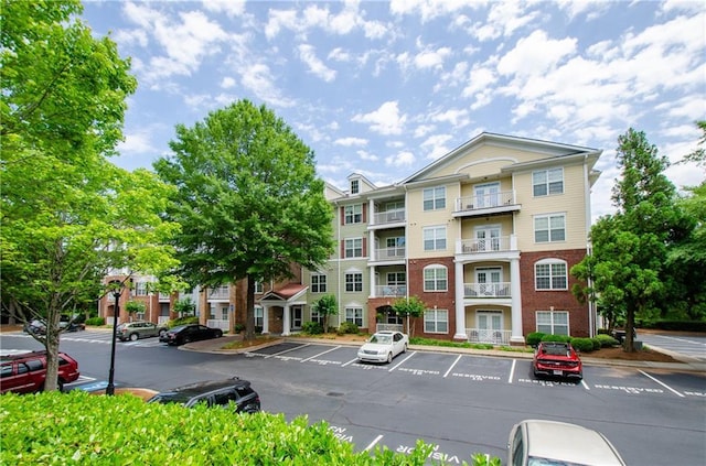 1965 Nocturne Dr Unit 1306A, Alpharetta, GA 30009 - view of building exterior with uncovered parking