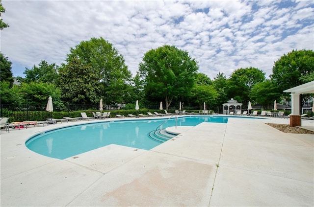 1965 Nocturne Dr Unit 1306A, Alpharetta, GA 30009 - community pool with a patio and view of scattered trees