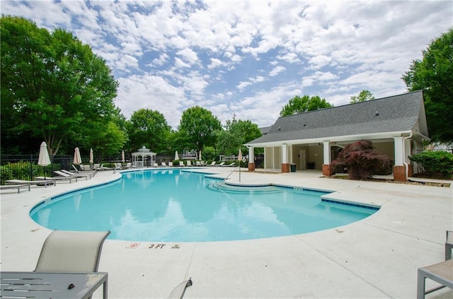 1965 Nocturne Dr Unit 1306A, Alpharetta, GA 30009 - community pool with a patio and view of scattered trees