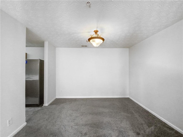 3217 Fairington Dr, Lithonia, GA 30038 - carpeted spare room featuring a textured ceiling and a pendent fire sprinkler