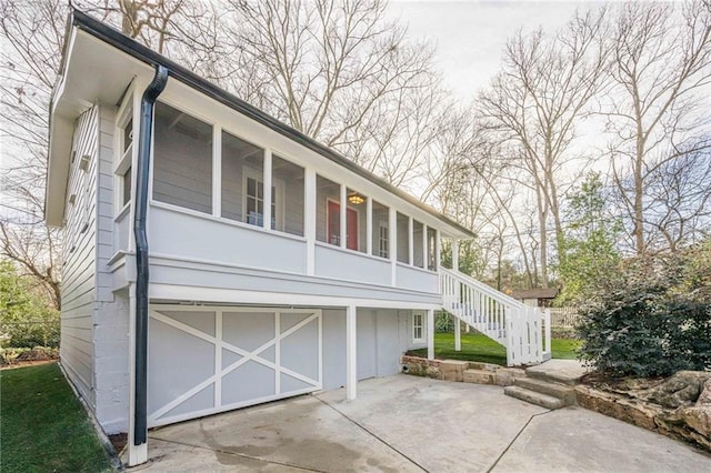 exterior space with a sunroom and stairway