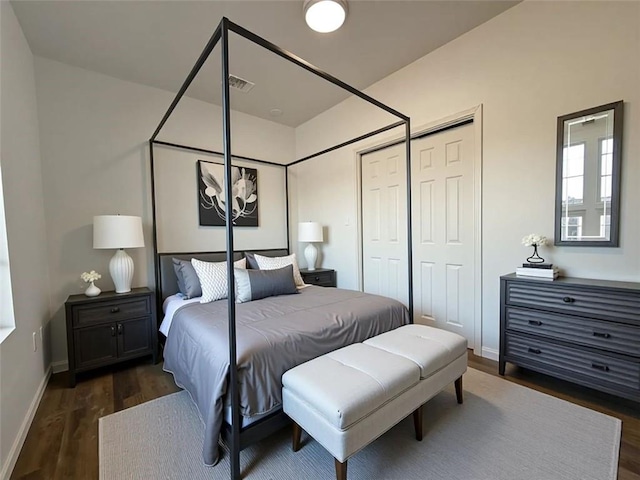2873 Shoals Hill Ct, Dacula, GA 30019 - bedroom featuring dark wood finished floors and a closet