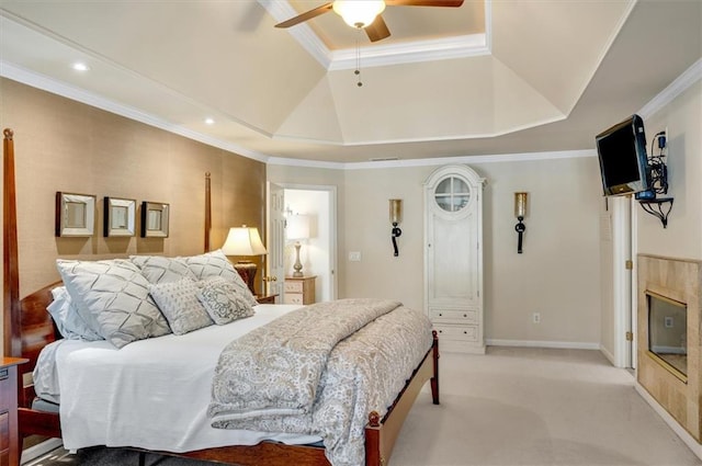 bedroom with light colored carpet, crown molding, a tray ceiling, and vaulted ceiling