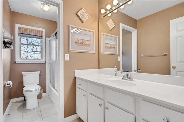 full bathroom featuring vanity, tile patterned floors, toilet, and baseboards