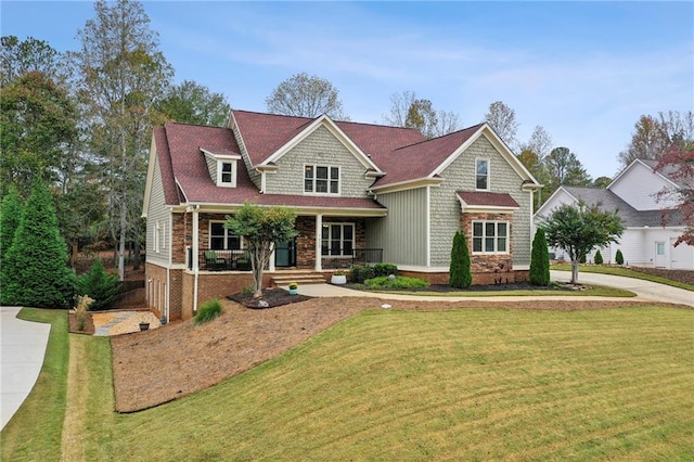 craftsman-style home with covered porch and a front lawn