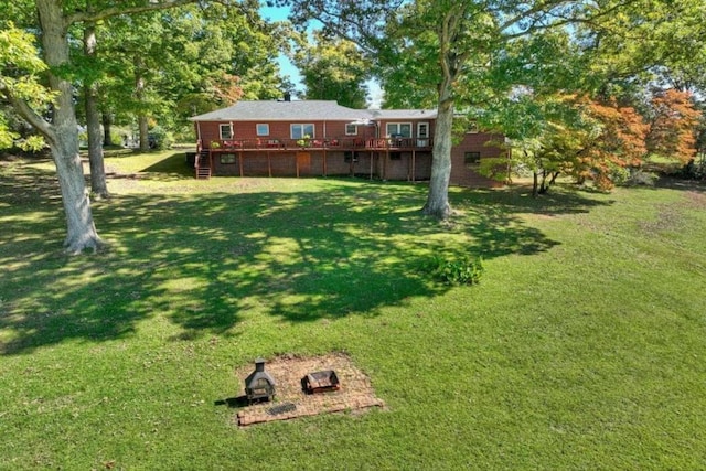 view of yard with a wooden deck