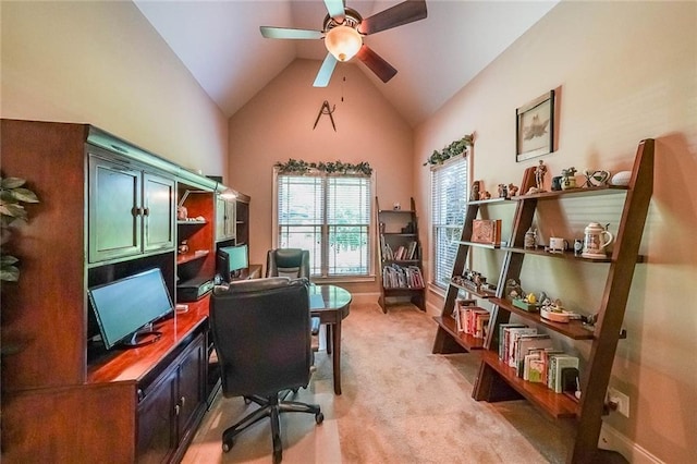 carpeted home office with high vaulted ceiling and ceiling fan