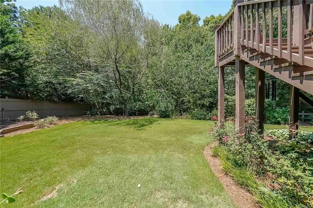 view of yard with a wooden deck