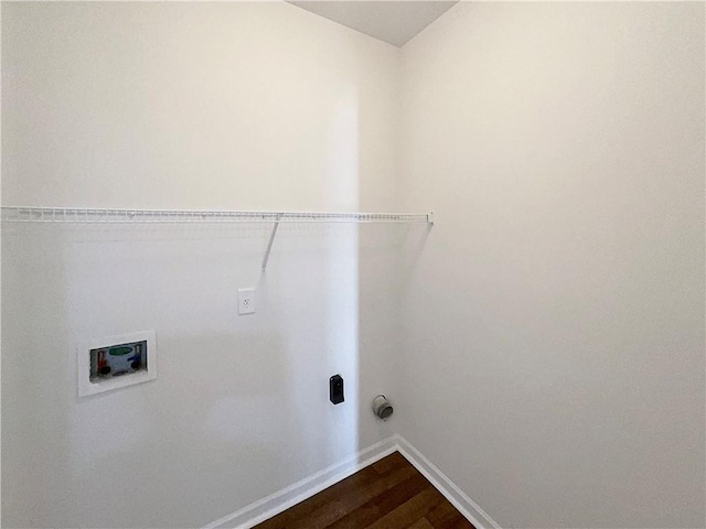 washroom with hookup for a washing machine, laundry area, baseboards, and dark wood-style flooring