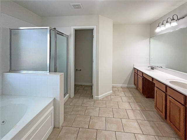 bathroom with visible vents, a sink, a shower stall, and a whirlpool tub