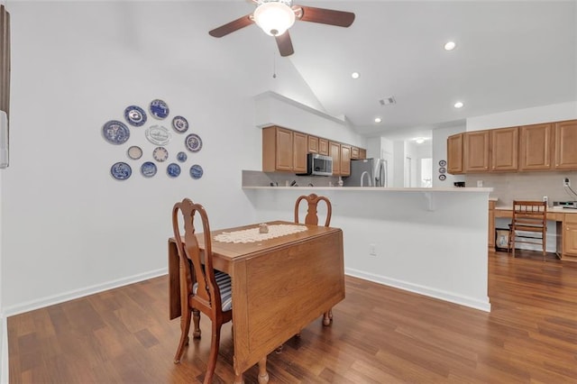 1402 Silver Summit Dr SE, Conyers, GA 30094 - dining space with a ceiling fan, recessed lighting, wood finished floors, and vaulted ceiling