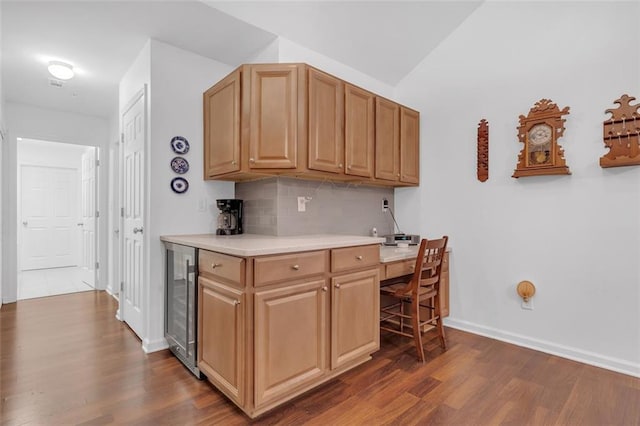 1402 Silver Summit Dr SE, Conyers, GA 30094 - kitchen featuring beverage cooler, dark wood-type flooring, tasteful backsplash, and light countertops