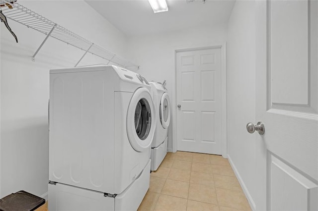 1402 Silver Summit Dr SE, Conyers, GA 30094 - laundry room with washer and dryer and light tile patterned floors