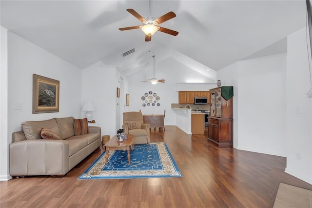 1402 Silver Summit Dr SE, Conyers, GA 30094 - living room featuring ceiling fan, dark wood finished floors, and lofted ceiling