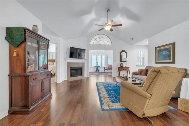 1402 Silver Summit Dr SE, Conyers, GA 30094 - living area with ceiling fan, a tiled fireplace, dark wood finished floors, and high vaulted ceiling